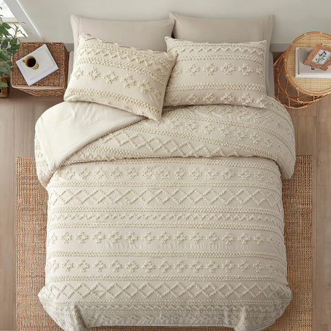 Oli Anderson comforter beside ruler showing king 102x88 dimensions for scale