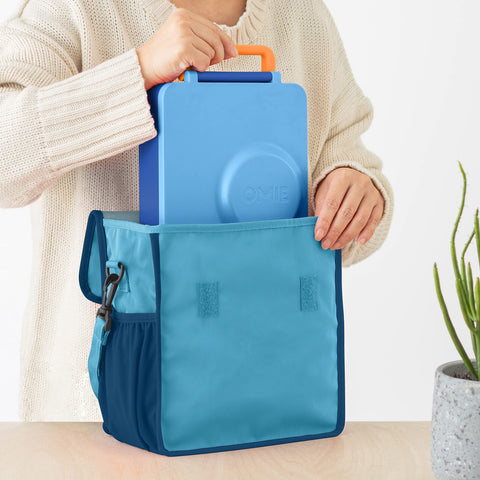 Omie exterior bottle pocket keeping a water bottle upright and accessible