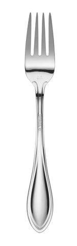 Oneida American Harmony next to dinner plate to show scale and balanced proportions