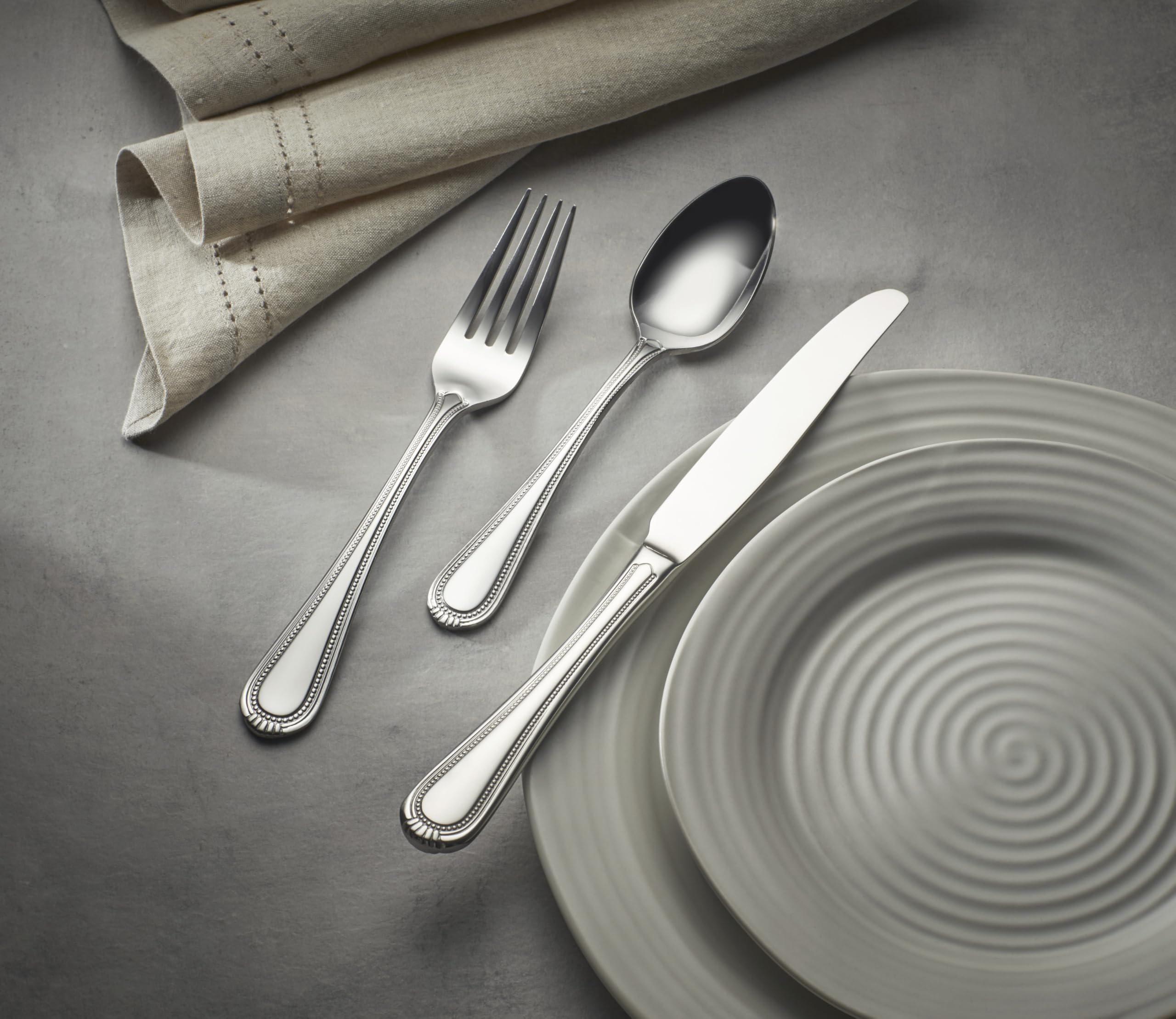 Hand holding a Oneida Countess fork illustrating size and comfortable grip