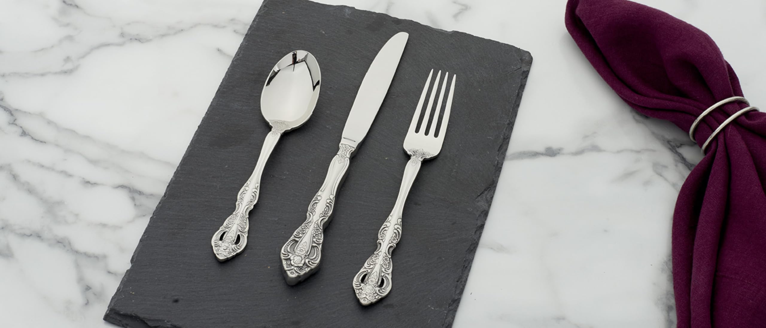 Oneida Michelangelo scale comparison with hand illustrating utensil size and balance