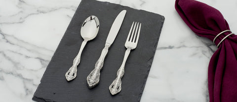 Oneida Michelangelo scale comparison with hand illustrating utensil size and balance