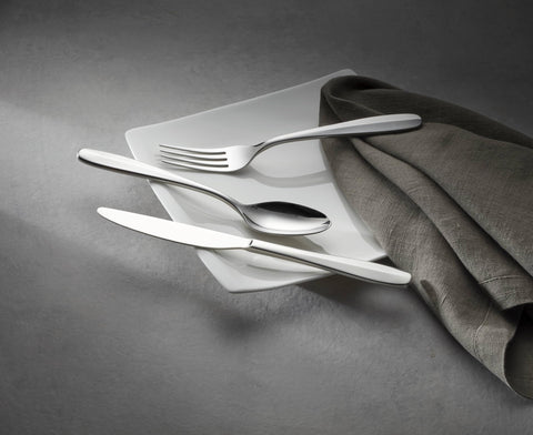 Oneida Oakwood spoons stacked to show bowl shape and polished reflective finish
