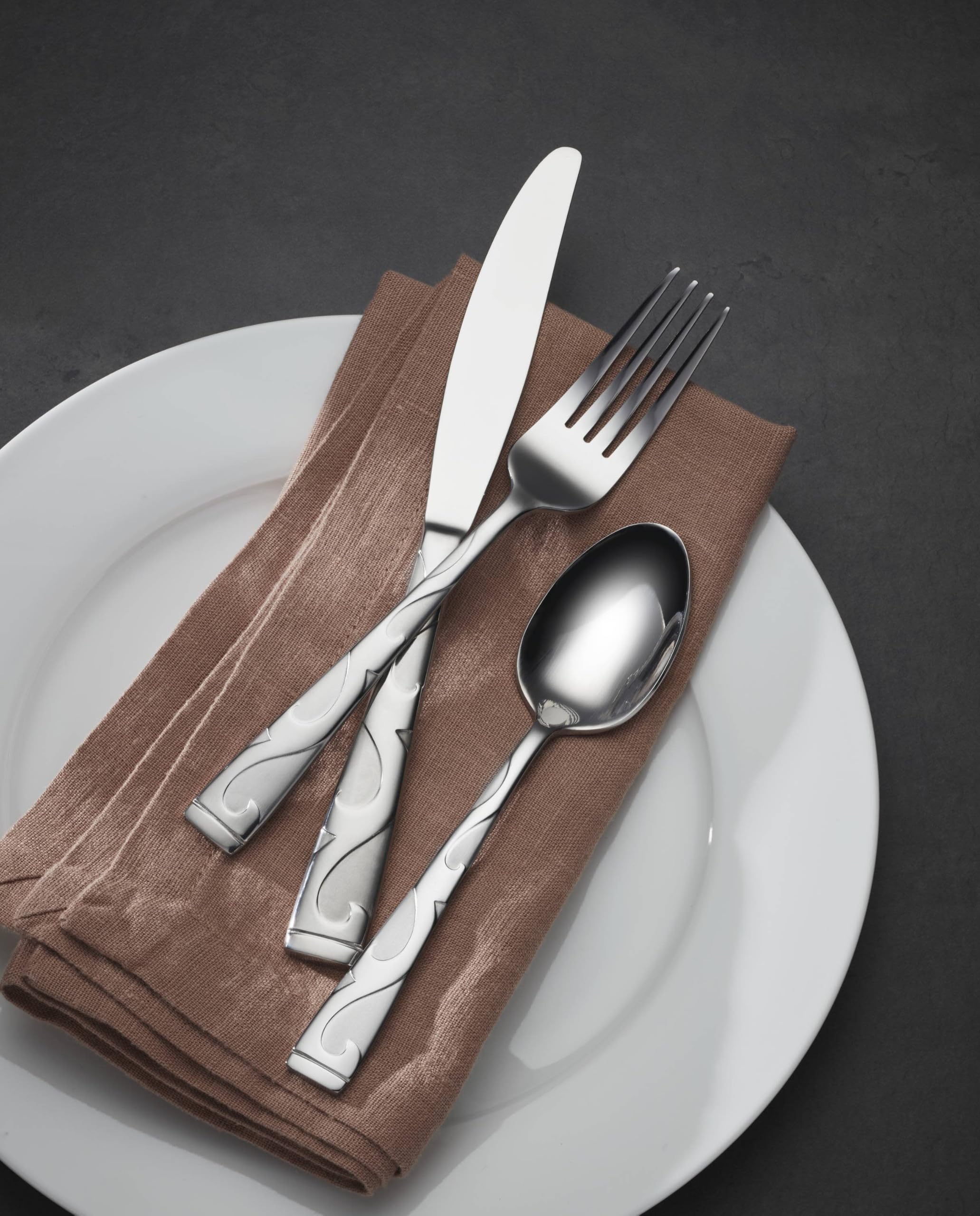 Oneida Tuscany knife and spoon detail showing mirrored ribbon contrast and grip