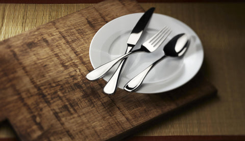 Oneida Voss polished finish reflecting light for an elegant table look