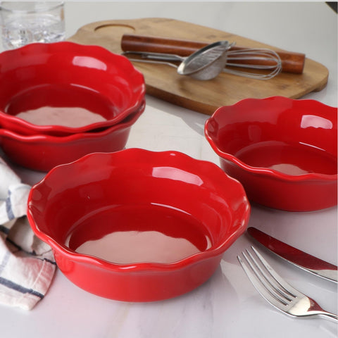 ONEMORE stacked pans beside utensils to show compact storage advantage