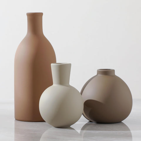 ooit front view of three brown ceramic vases showing rustic shapes and versatile decor benefit