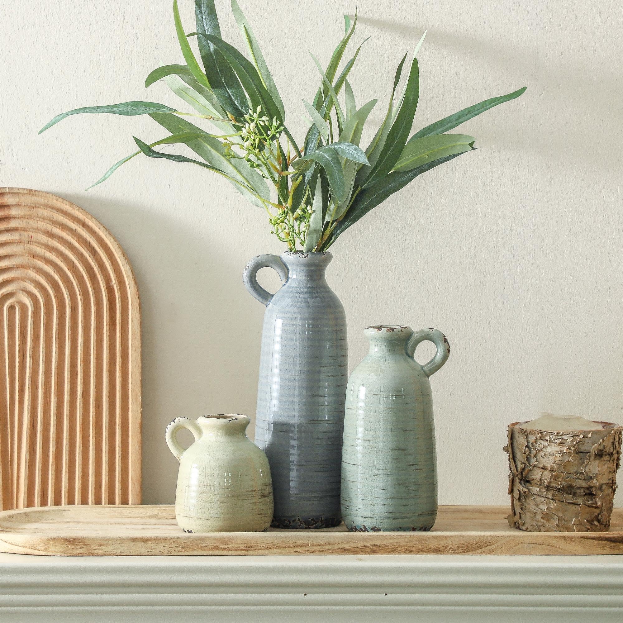 ooit vases styled on dining table to create warm inviting table centerpiece