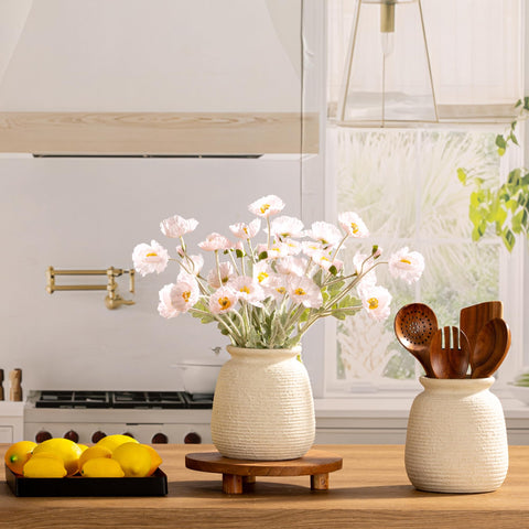 ooit vase next to hand to show scale and tabletop suitability