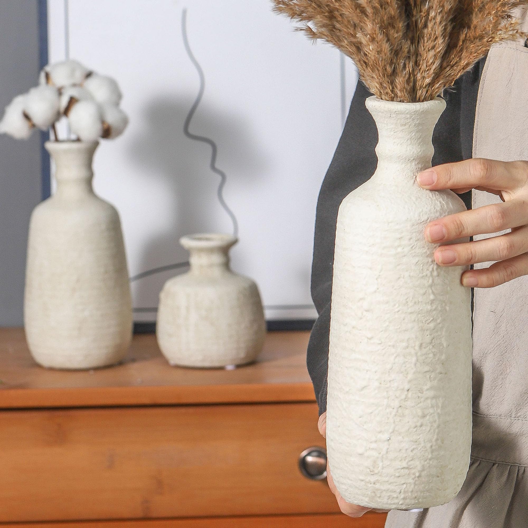 ooit group of vases styled on dining table adding cohesive centerpiece charm