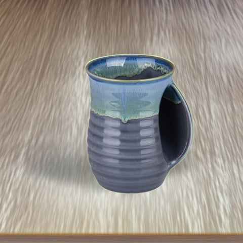 oojdzoo mug in use with coffee demonstrating steady, cozy grip