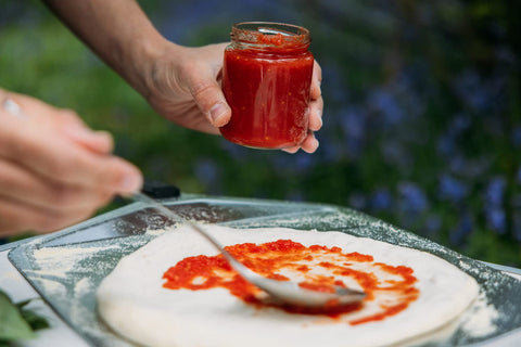 ooni peel used to launch pizza into an Ooni oven for safe handling