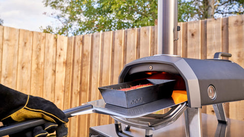 ooni peel in outdoor pizza party setting for fast, repeatable cooking