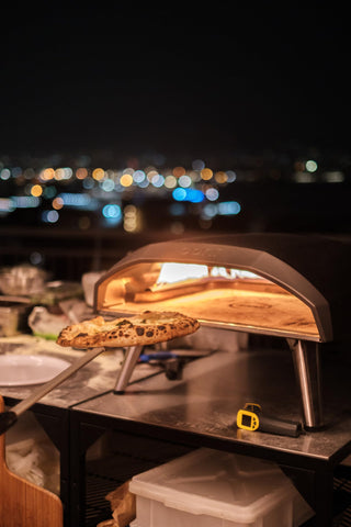 ooni angled paddle surface showing anodized finish for non-stick sliding benefit