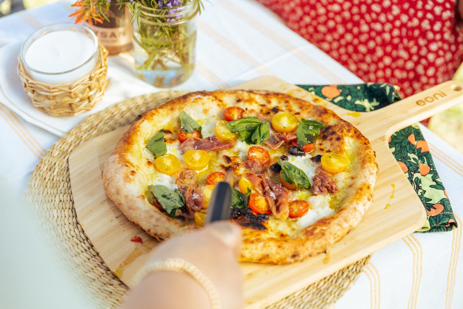ooni bamboo serving on table presenting pizza attractively for guests