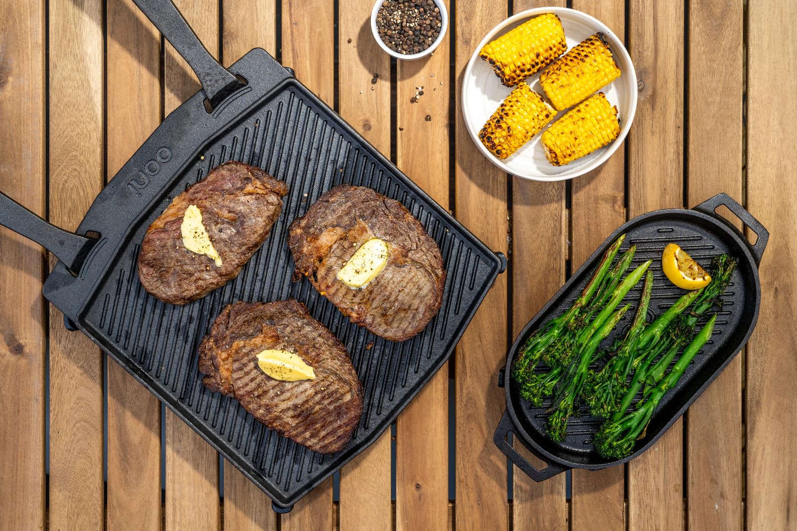 ooni Grizzler on outdoor table with food showing serving presentation and rugged design