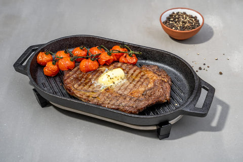 ooni Grizzler stainless steel trivet closeup protecting surfaces and stabilizing pan