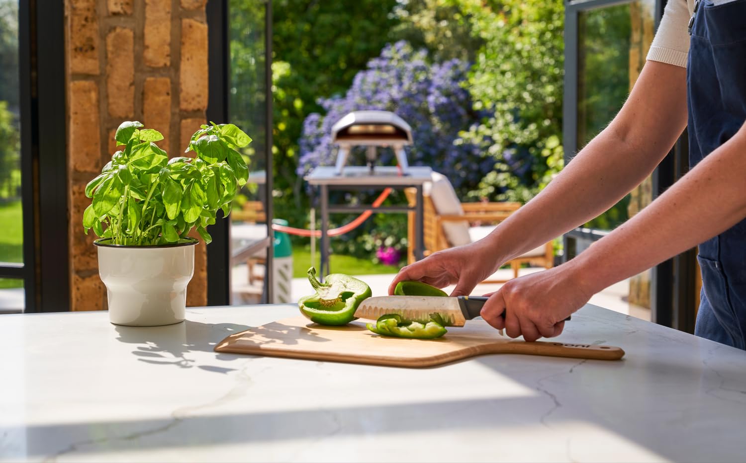 ooni peel serving board with sliced pizza ready to serve and present