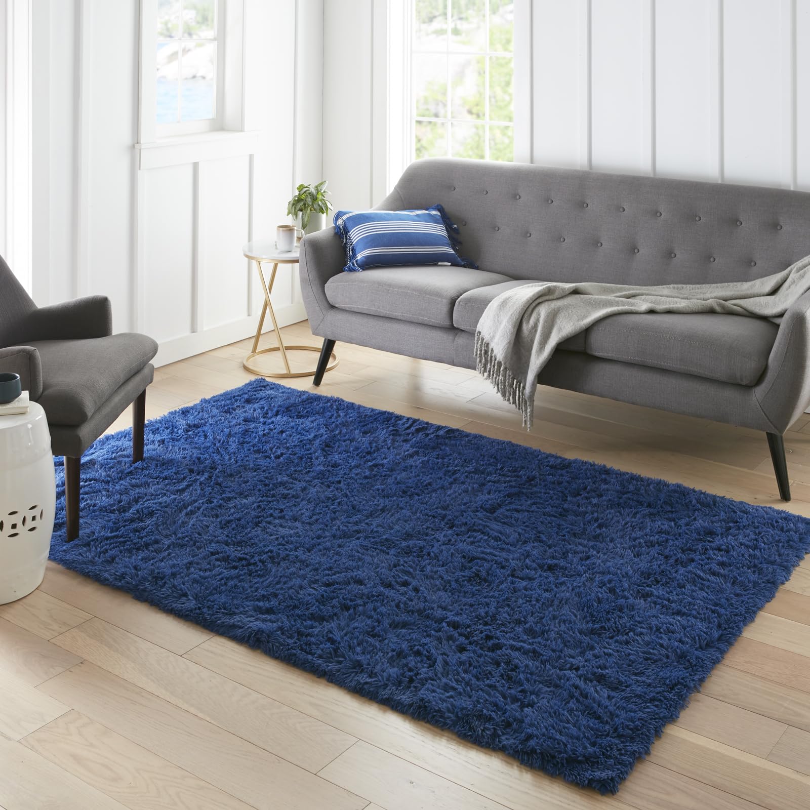 Ophanie front view showing royal dark blue rug and clean edge benefit