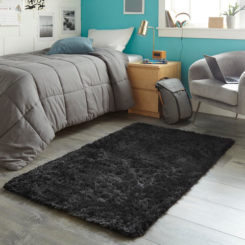 Ophanie next to bed for scale illustrating compact size and bedside comfort