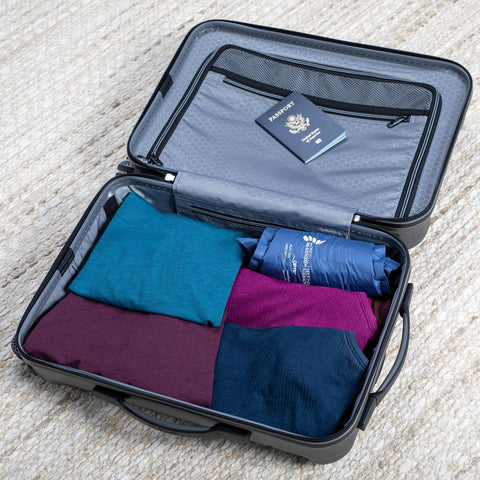 OPTP AirBack tucked inside travel bag ready for commuting and trips