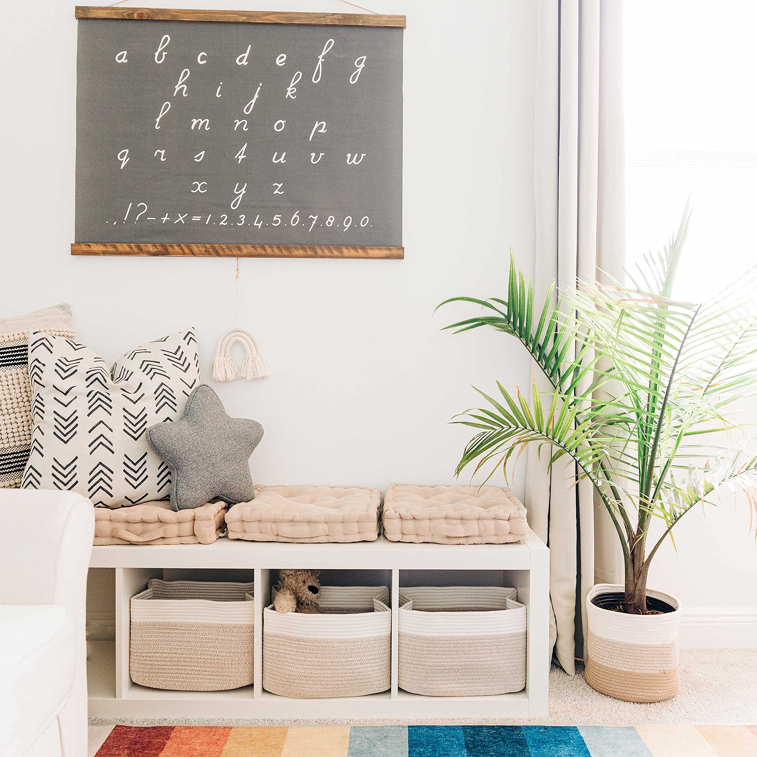 OrganiHaus basket in living room holding blankets for tidy accessible storage
