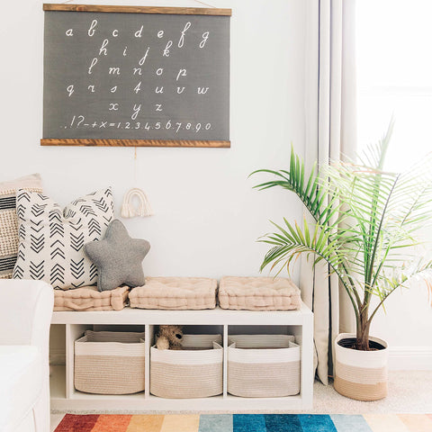 OrganiHaus basket in living room holding blankets for tidy accessible storage