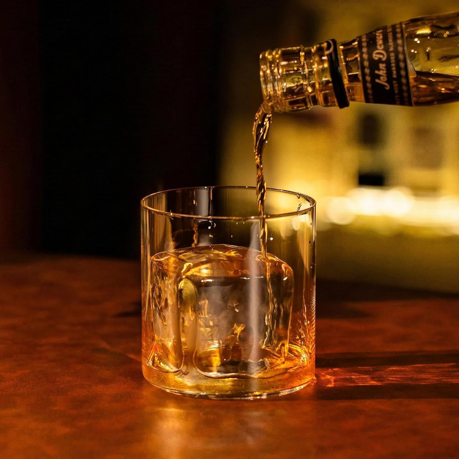 ORI Future GLAZER mini placed beside whiskey glass showing elegant presentation benefit
