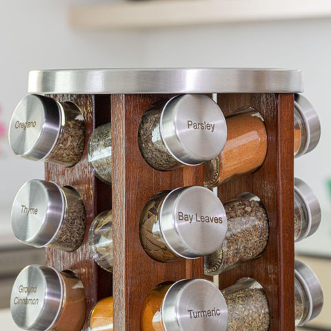 Orii spice rack next to hand for scale demonstrating compact footprint
