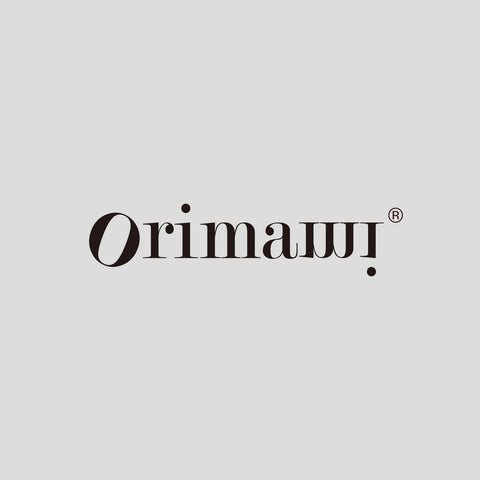 ORIMAMI scale comparison in hand demonstrating compact size and portability