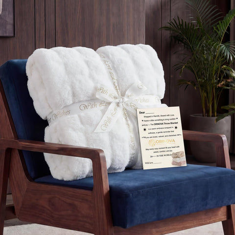ORINOVA draped on bed illustrating decorative layering and cozy appeal