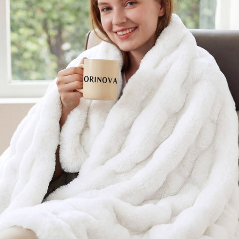 ORINOVA front view showing white faux rabbit fur throw elegance and warmth