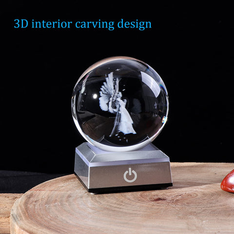 Ornalrist crystal ball held in hand showing 8 cm scale and portability