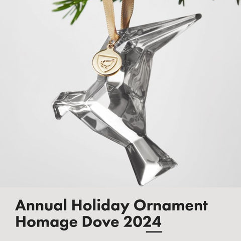 Orrefors Homage Dove side profile highlighting smooth contours and light play