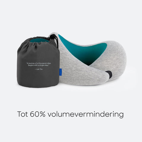 Ostrichpillow next to passport showing travel-ready size advantage