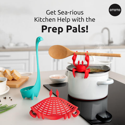 OTOTO Red the Crab spoon rest close-up holding a wooden spoon and protecting counter