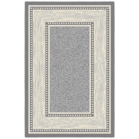 Ottomanson small rug inside an entryway capturing dirt and adding style