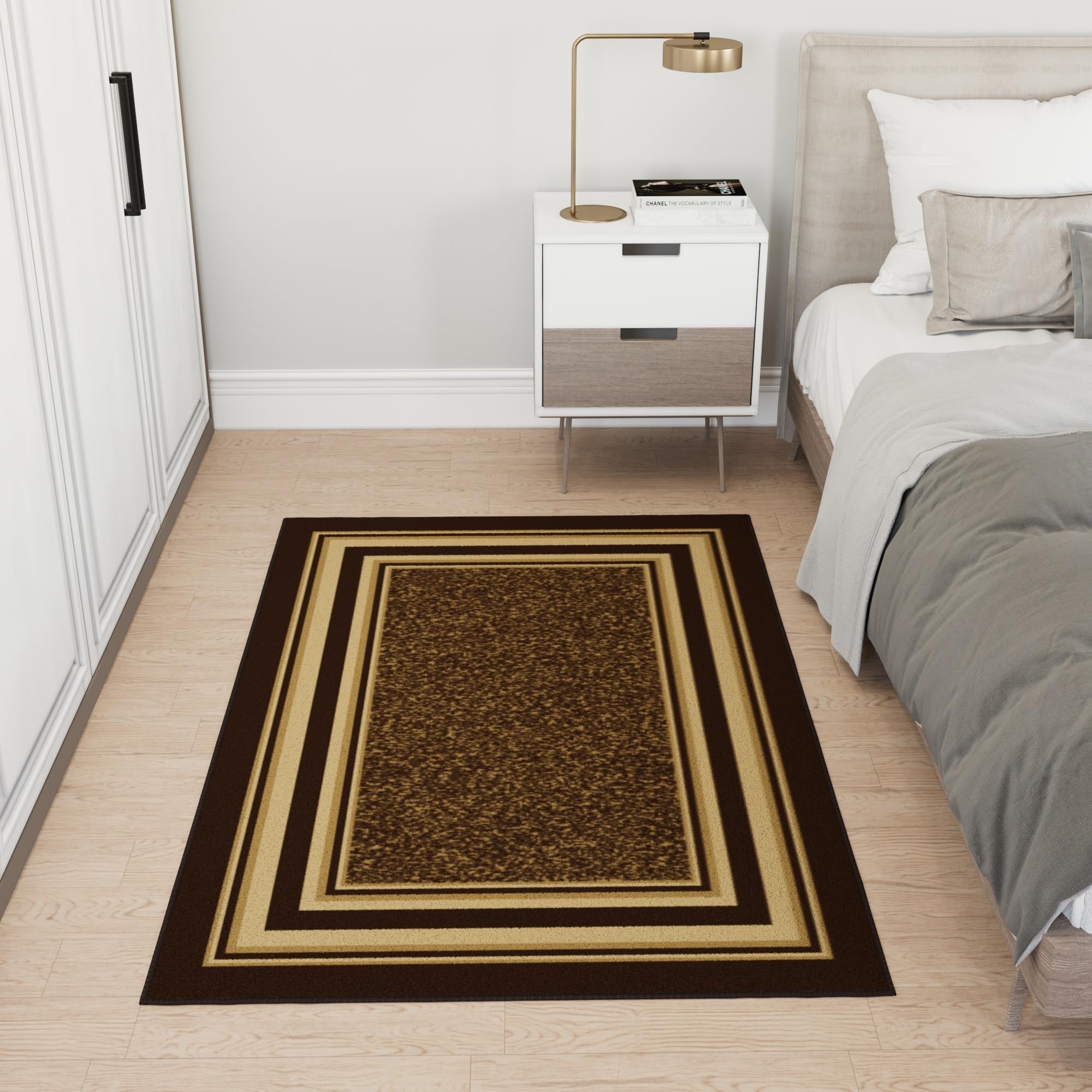 Ottomanson rug beside chair to show scale and appropriate room placement