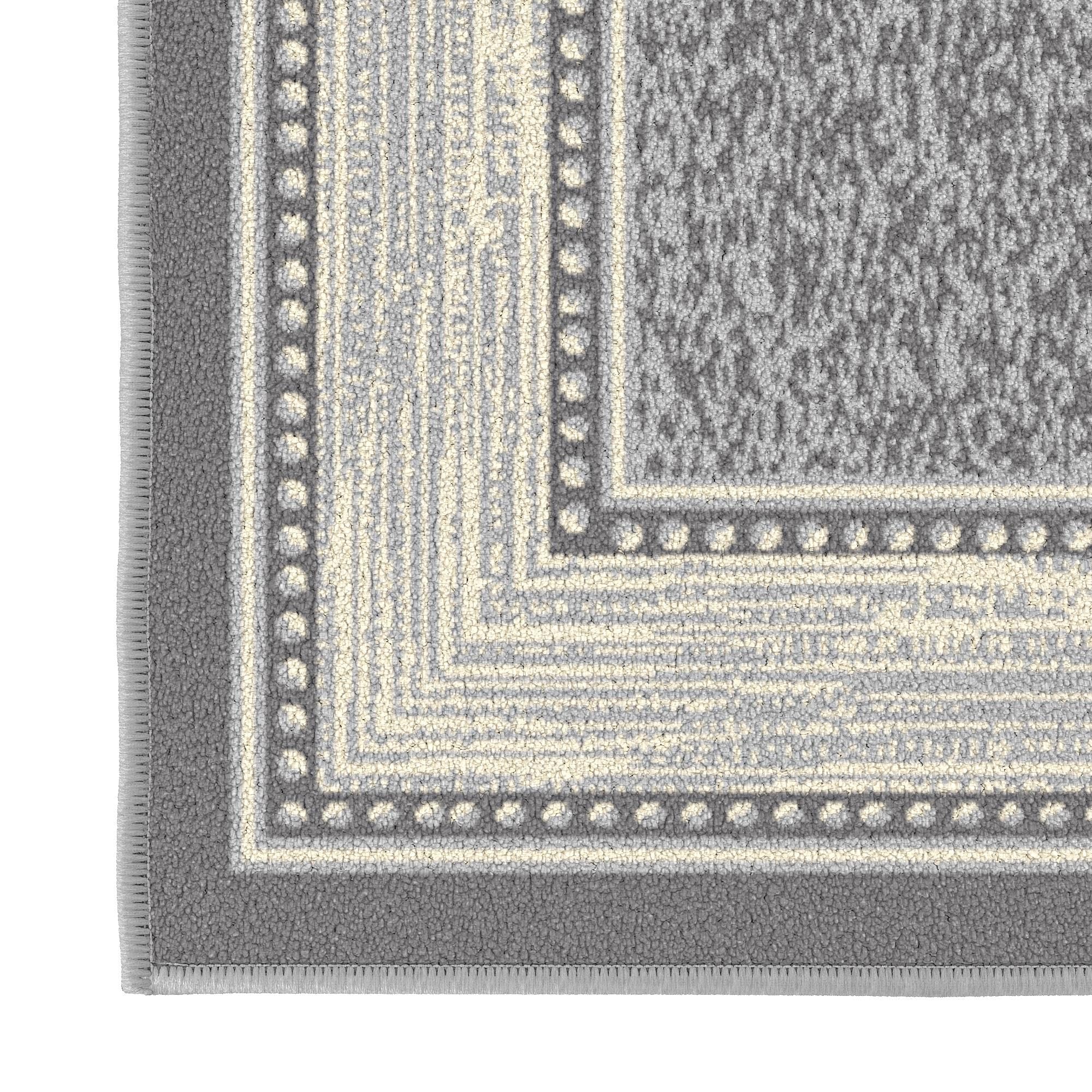 Ottomanson rug beside shoe to show scale and suitability for small spaces