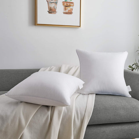 Oubonun inserts on bed emphasizing layered decor and comfortable back support