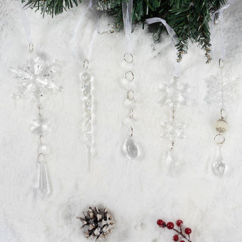 OuMuaMua ornaments arranged in a winter table centerpiece creating frosted holiday ambiance