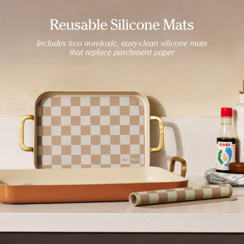 Our Place reusable silicone mats nested inside griddle saving space and waste