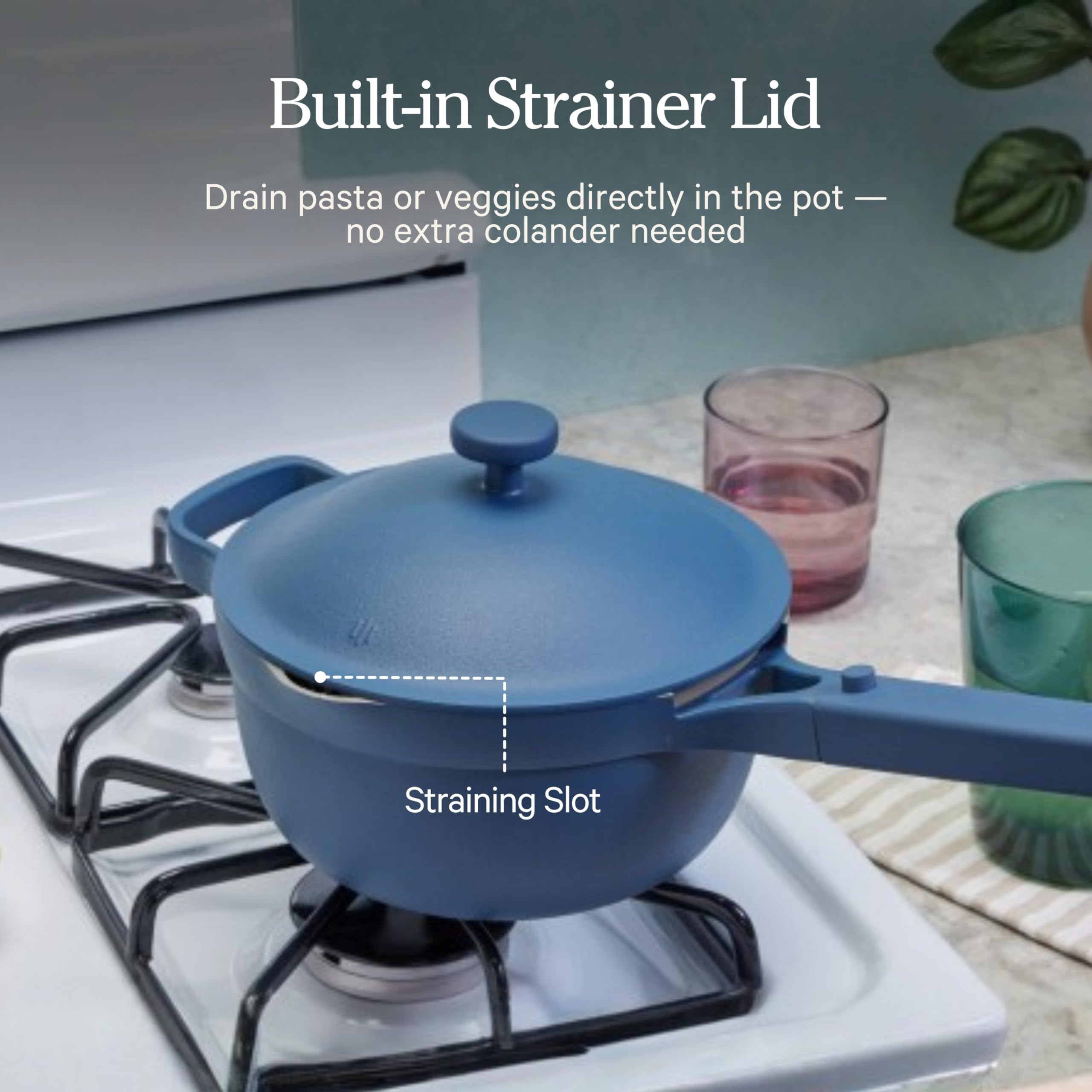 Our Place draining pasta with lid to show built-in strainer and quick draining benefit