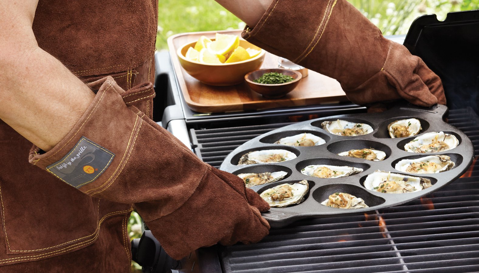 Outset oyster pan with grilled oysters on half shell demonstrating stable cooking and presentation