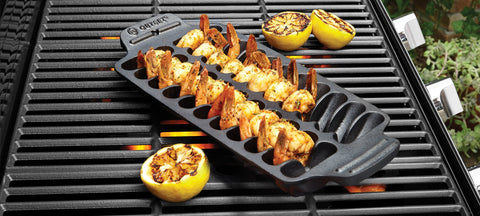Outset shrimp pan on a hot grill cooking shrimp evenly with smoky flavor
