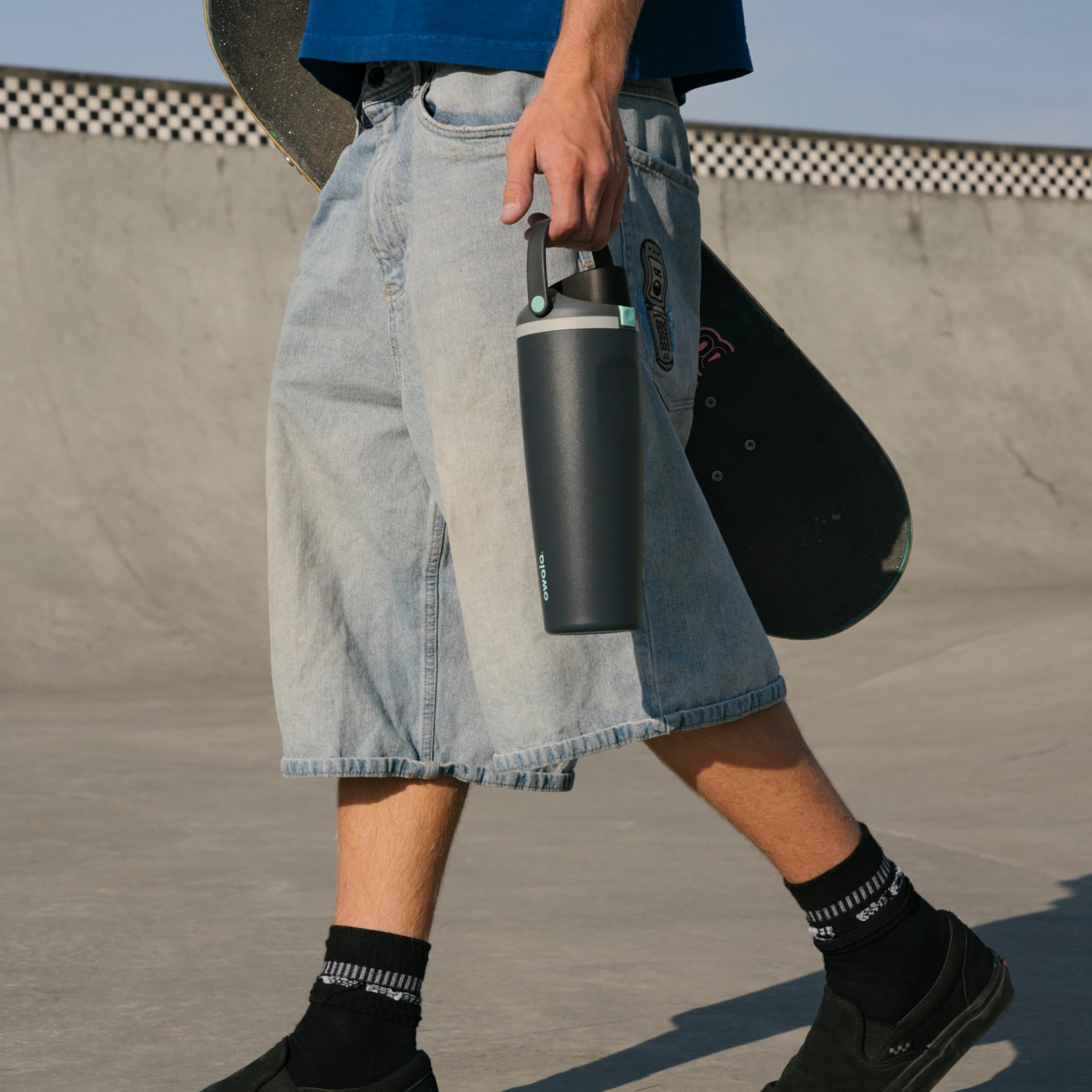 Owala FreeSip Sway on a trail with backpack showing portable outdoor hydration