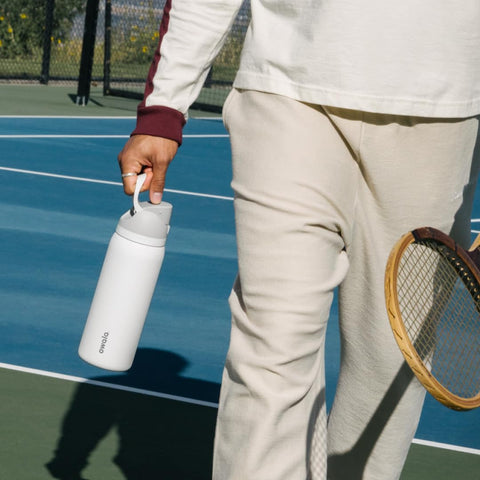 Owala FreeSip in gym setting showing portability and active-use benefit