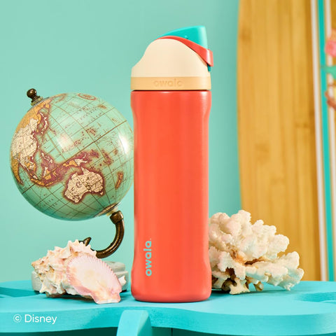 Owala bottle in hand for scale showing compact 24 oz size and carry loop