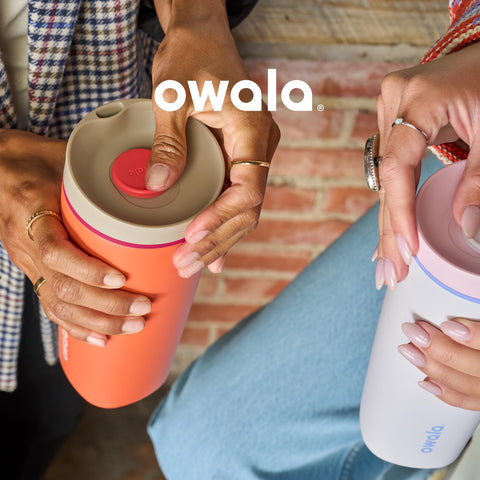 Owala SmoothSip lid and hand holding cup, ergonomic grip convenience