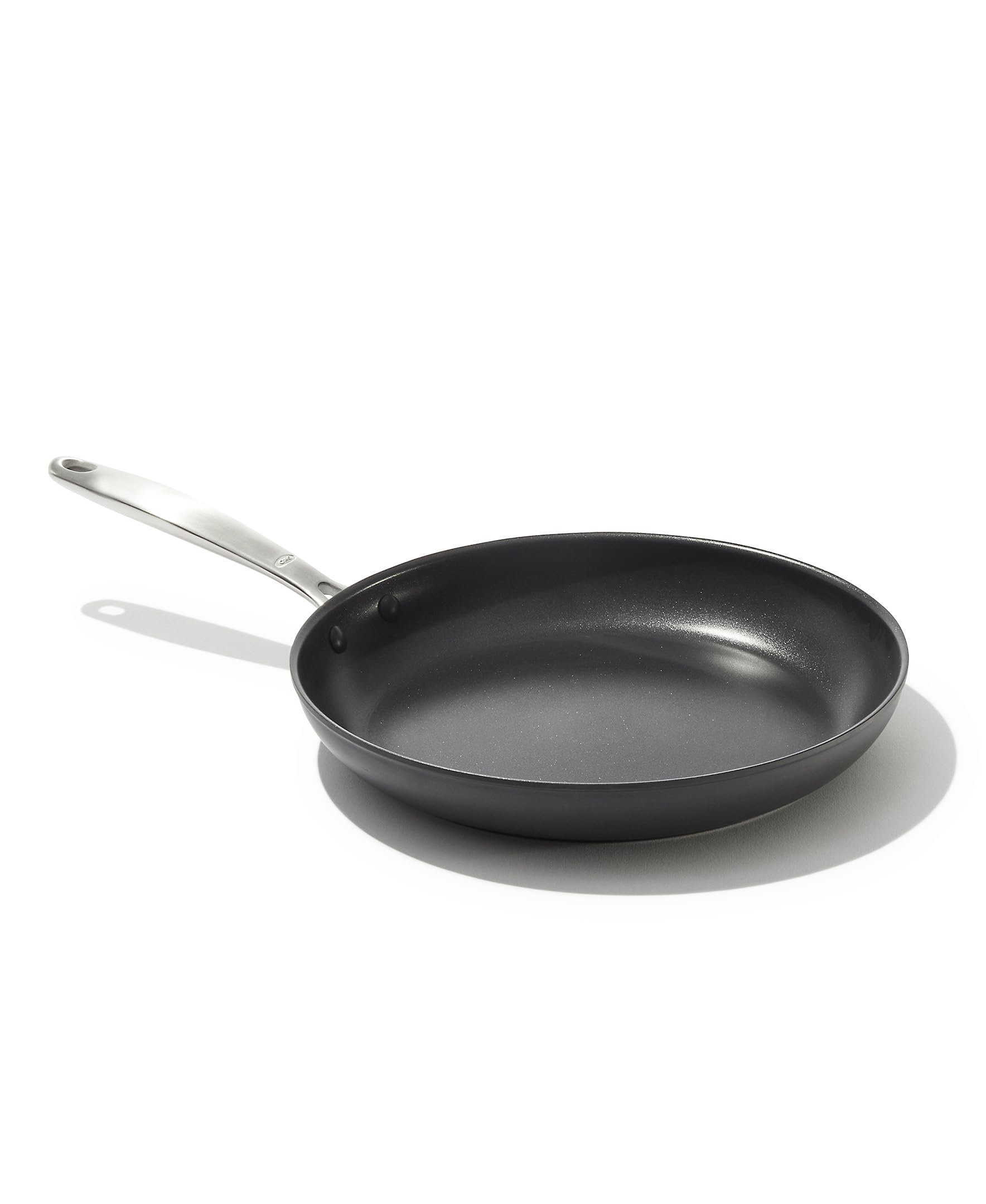 OXO 10-inch frying pan front view showing black hard-anodized finish and handle for durable cooking